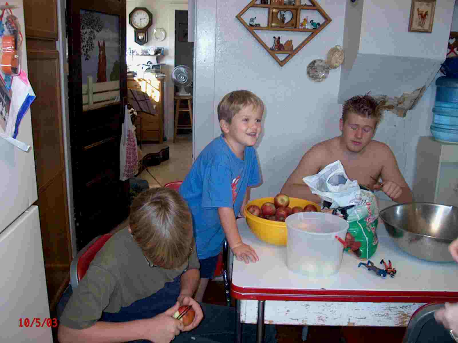 Three boys peeling apples!